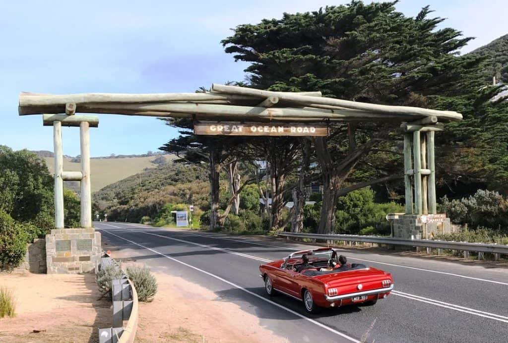 Convertible car driving the Great Ocean Road — BagBoyz® luggage storage in Melbourne makes road trips hands-free